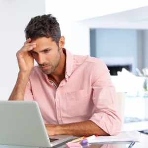 male using laptop and stress out